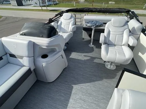Slide: The Image of 2024 Sweetwater 2286SFL pontoon boat interior with plush seating and modern helm. - 13