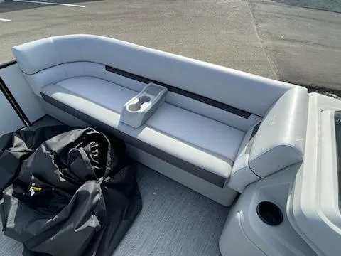 Slide: The Image of 2024 Sweetwater 2286SFL pontoon boat with gray seating and cup holders. - 14