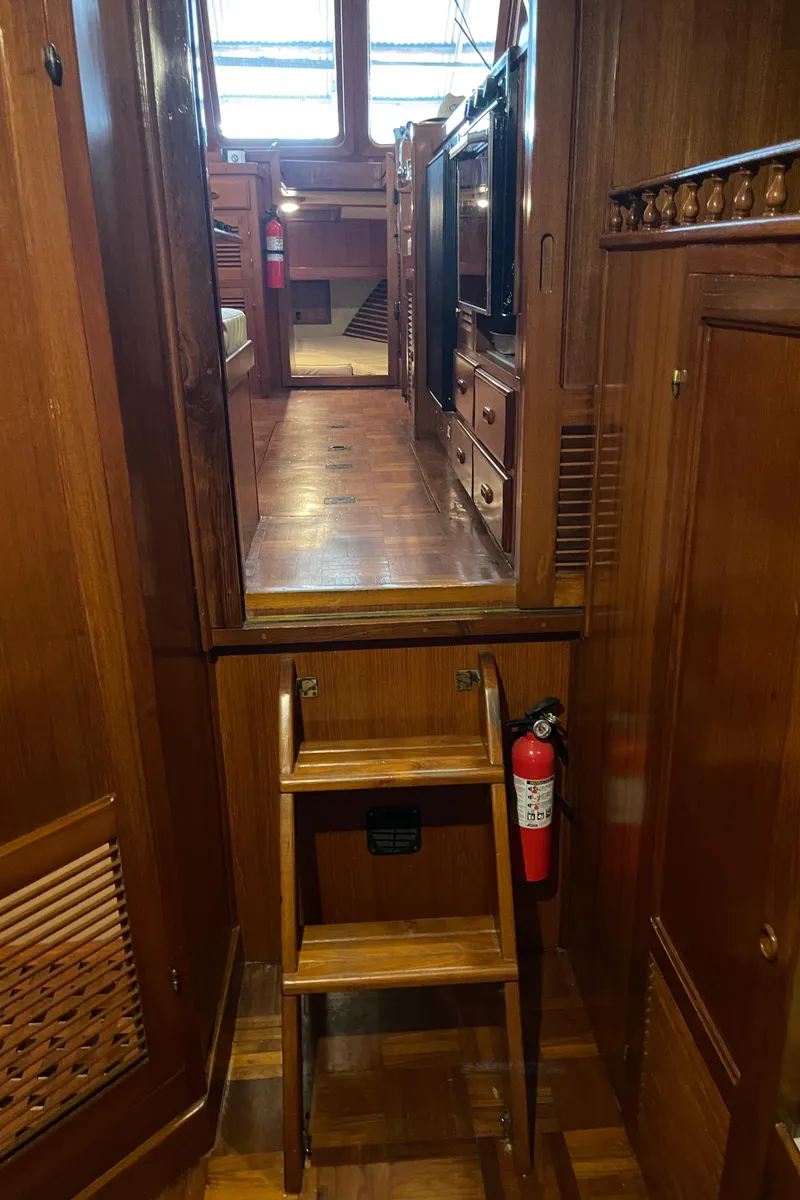 Slide: The Image of Interior of a 1984 CHB 35 boat with wooden ladder and cabinetry. - 15