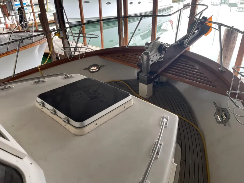 Slide: The Image of 1984 CHB 35 boat deck with hatch and winch in marina. - 20