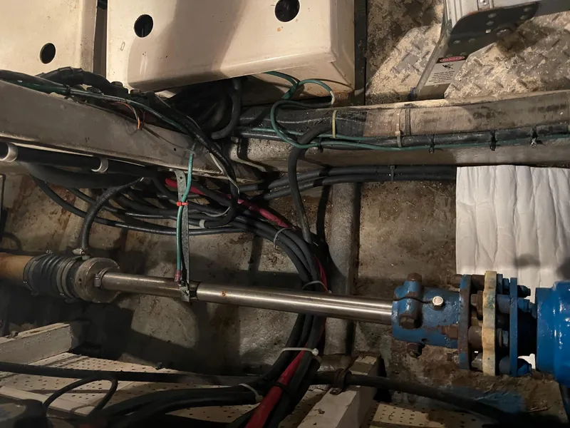 Slide: The Image of Engine room of a 1984 CHB 35 boat with visible wiring and mechanical components. - 21