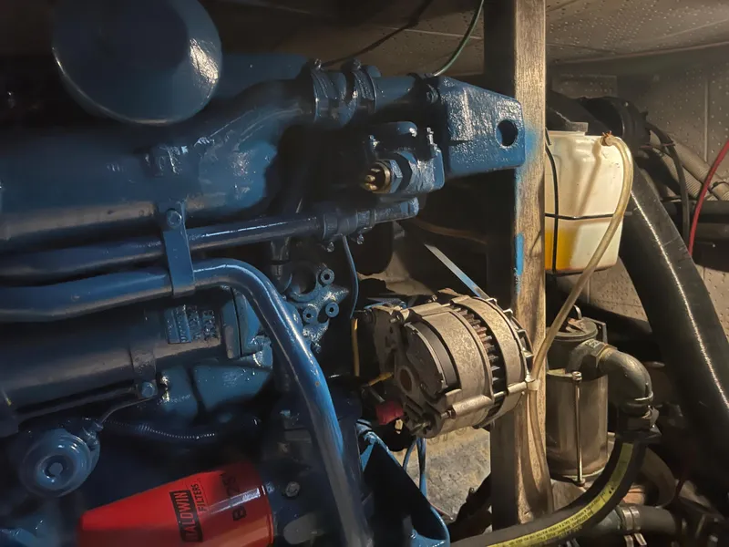 Slide: The Image of Engine compartment of a 1984 CHB 35 boat with visible components. - 22