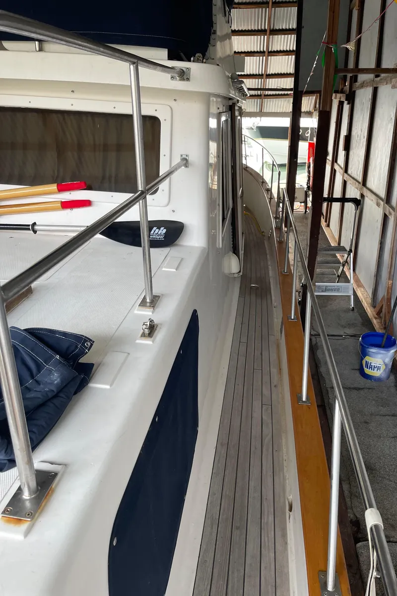 Slide: The Image of 1984 CHB 35 yacht docked in a covered marina. - 25