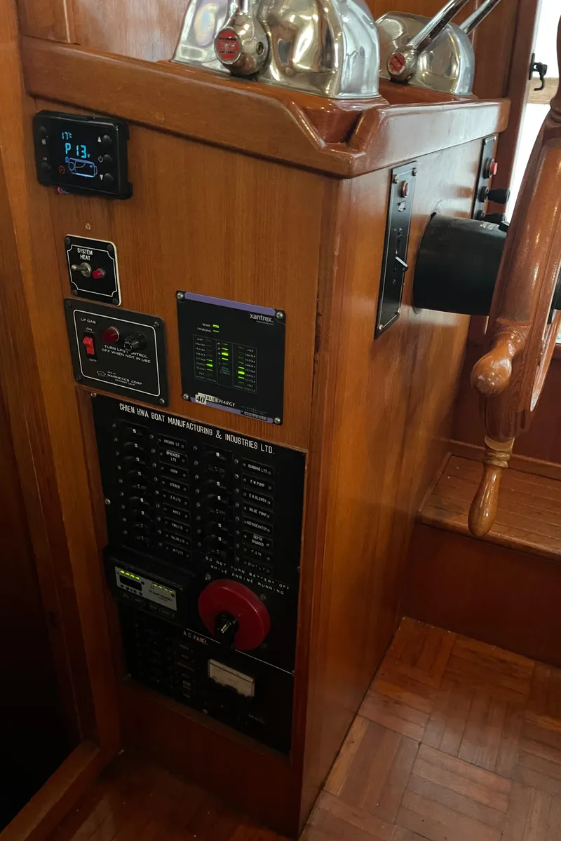 Slide: The Image of Control panel of a 1984 CHB 35 boat with various switches and gauges. - 28