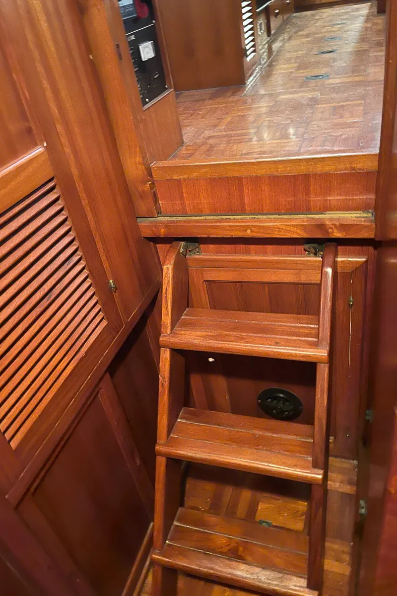 Slide: The Image of Wooden interior stairs of a 1984 CHB 35 boat. - 36