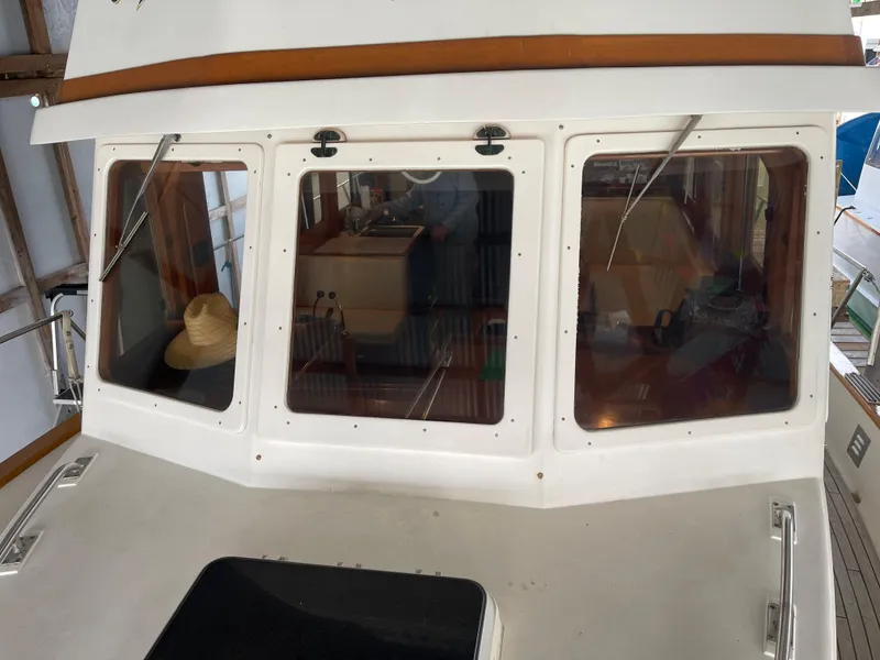 Slide: The Image of 1984 CHB 35 boat cabin with windows and interior view. - 5