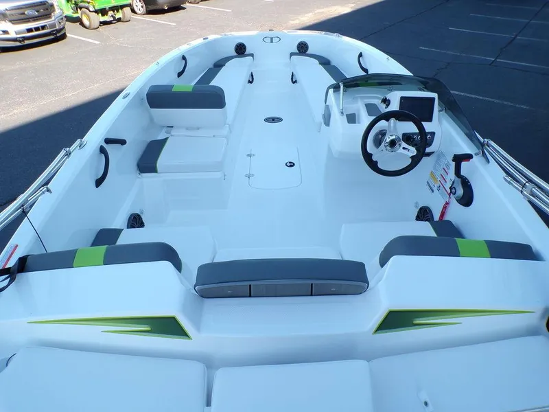 Slide: The Image of 2024 Tahoe T18 boat interior with seating and steering console. - 13