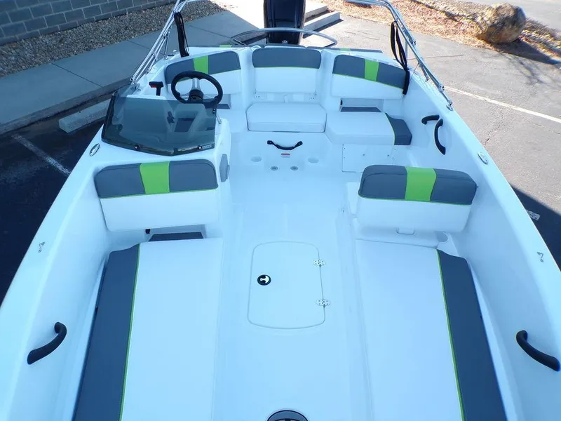 Slide: The Image of 2024 Tahoe T18 boat interior with gray and green seating. - 14