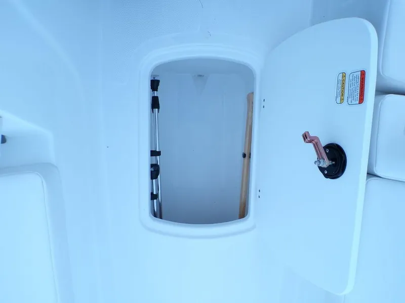 Slide: The Image of Open storage compartment in 2024 Tahoe T18 boat. - 17