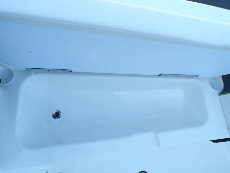 Slide: The Image of 2024 Tahoe T18 boat storage compartment, white interior. - 19