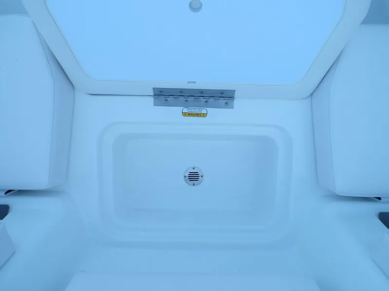 Slide: The Image of 2024 Tahoe T18 boat storage compartment with drain. - 23
