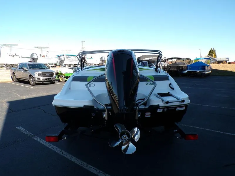 Slide: The Image of 2024 Tahoe T18 boat with outboard motor in parking lot. - 7