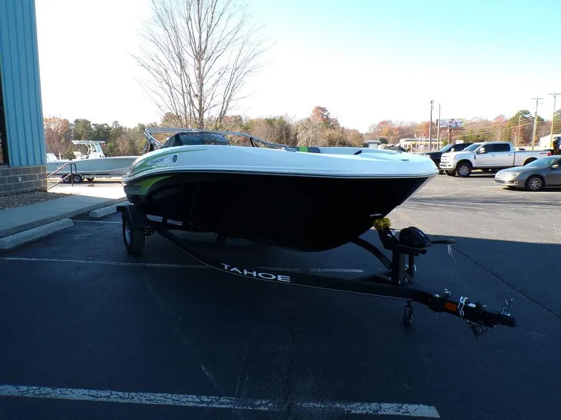 Slide: The Image of 2024 Tahoe T18 boat on trailer in parking lot. - 8