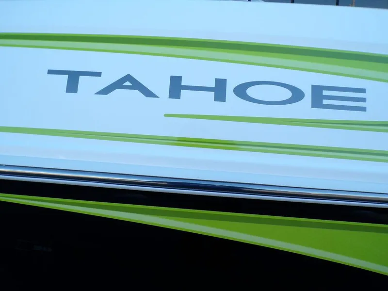 Slide: The Image of 2024 Tahoe T18 boat with green and white design. - 9