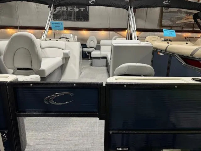 The Image of 2024 Crest Classic LX 200 C4 pontoon boat interior with luxurious seating. - 0