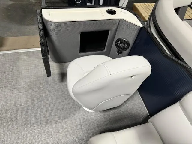 Slide: The Image of 2024 Crest Classic LX 200 C4 boat interior with white seating and control panel. - 5