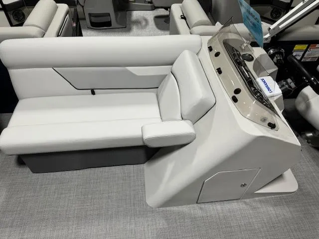 Slide: The Image of 2024 Crest Classic LX 200 C4 boat interior with white seating and control console. - 8