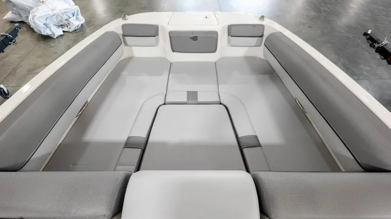 Slide: The Image of 2024 Bayliner DX 2000 boat interior with spacious gray seating and modern design. - 16