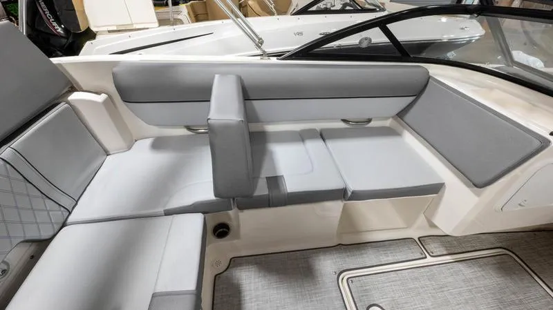 Slide: The Image of 2024 Bayliner DX 2000 boat interior with gray seating and modern design. - 19