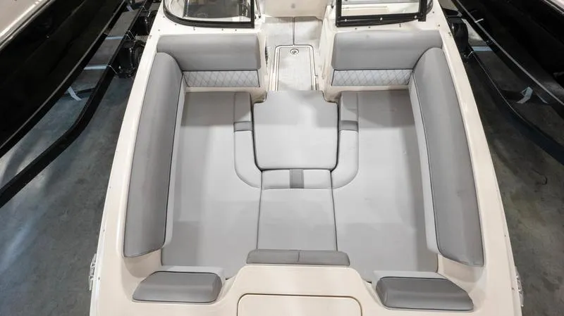 Slide: The Image of 2024 Bayliner DX 2000 boat interior with spacious seating and modern design. - 20