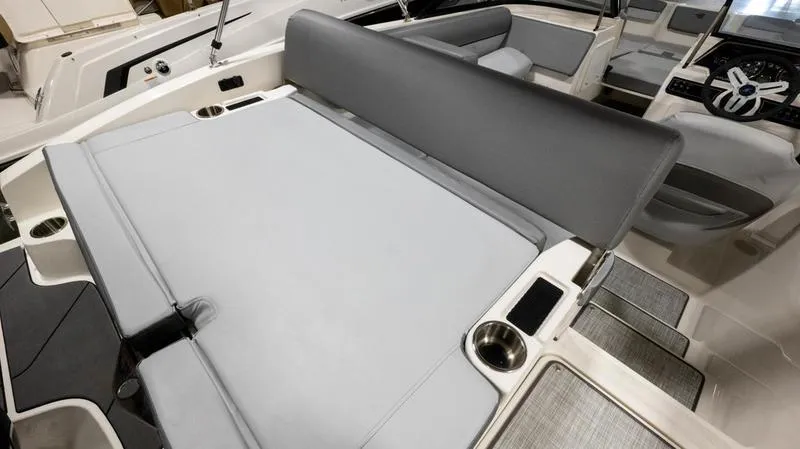 Slide: The Image of 2024 Bayliner DX 2000 boat interior with gray seating and cup holders. - 27