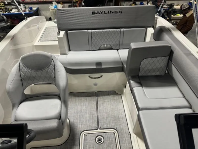 Slide: The Image of 2024 Bayliner DX 2000 boat interior with gray seating and modern design. - 3