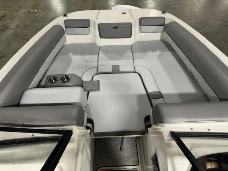 Slide: The Image of 2024 Bayliner DX 2000 boat interior with gray seating and cup holders. - 7