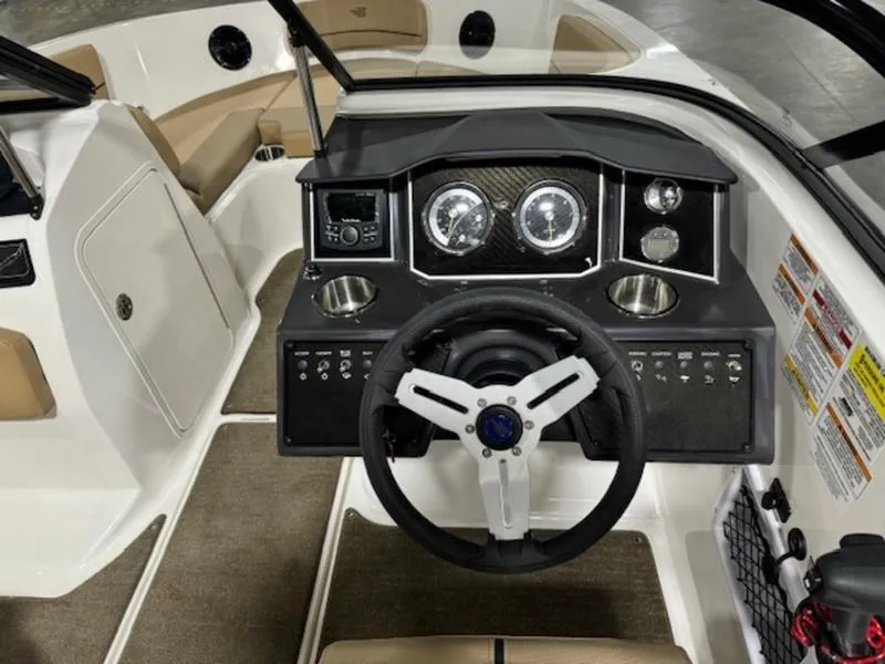 Slide: The Image of 2024 Bayliner VR5 Bowrider Outboard dashboard and steering wheel. - 5