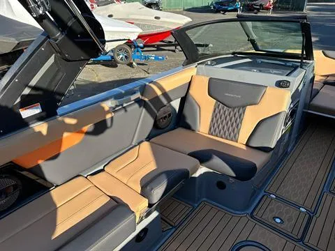 Slide: The Image of 2024 MasterCraft XT24 boat interior with tan and gray seating. - 13