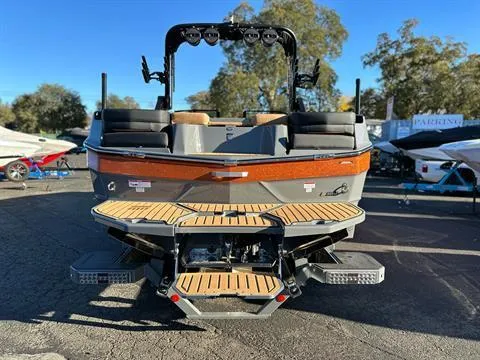 Slide: The Image of 2024 MasterCraft XT24 boat rear view with swim platform and seating. - 3