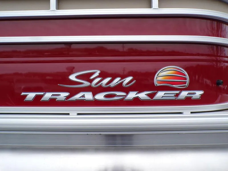 Slide: The Image of 2024 Sun Tracker PARTY BARGE® 20 DLX logo on red boat exterior - 11