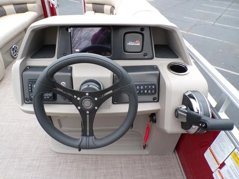 Slide: The Image of 2024 Sun Tracker PARTY BARGE® 20 DLX helm with steering wheel and control panel. - 14
