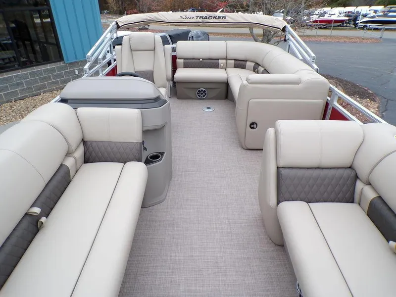 Slide: The Image of 2024 Sun Tracker PARTY BARGE® 20 DLX interior with plush seating and modern amenities. - 17