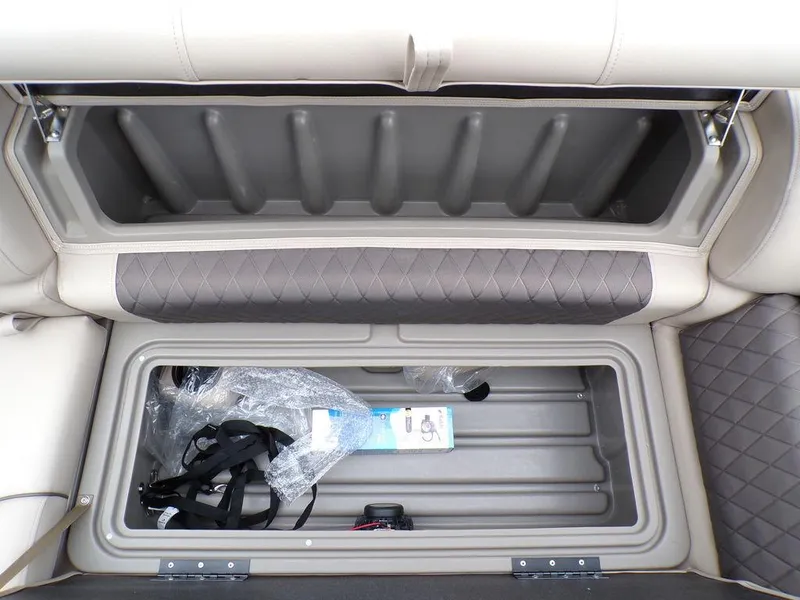 Slide: The Image of Sun Tracker PARTY BARGE® 20 DLX 2024 storage compartment with accessories. - 23
