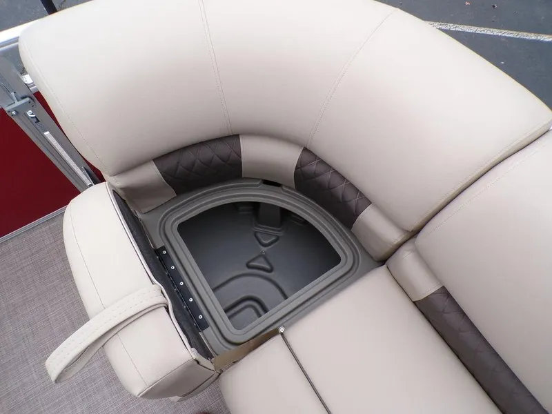 Slide: The Image of 2024 Sun Tracker PARTY BARGE® 20 DLX storage compartment under cushioned seating. - 24