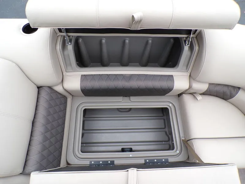 Slide: The Image of 2024 Sun Tracker PARTY BARGE® 20 DLX storage compartments with cushioned seating. - 28