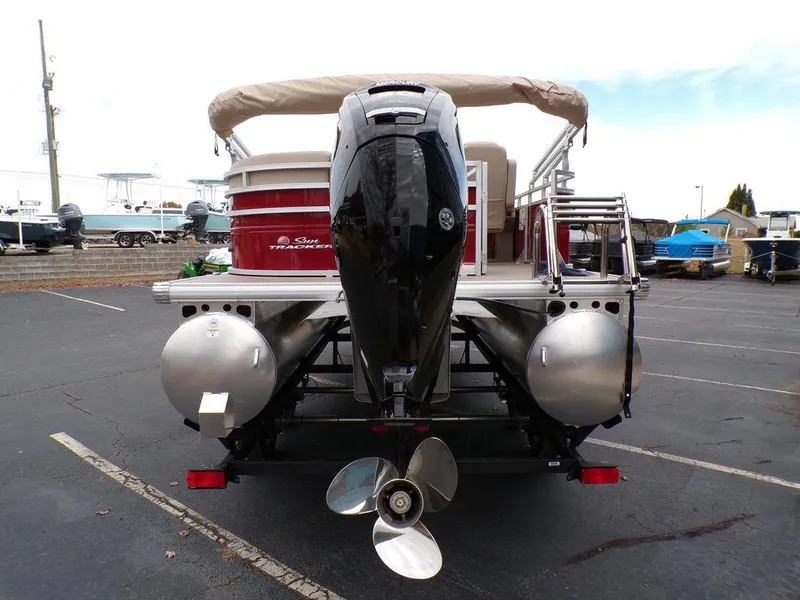 Slide: The Image of 2024 Sun Tracker PARTY BARGE® 20 DLX pontoon boat rear view with outboard motor. - 5