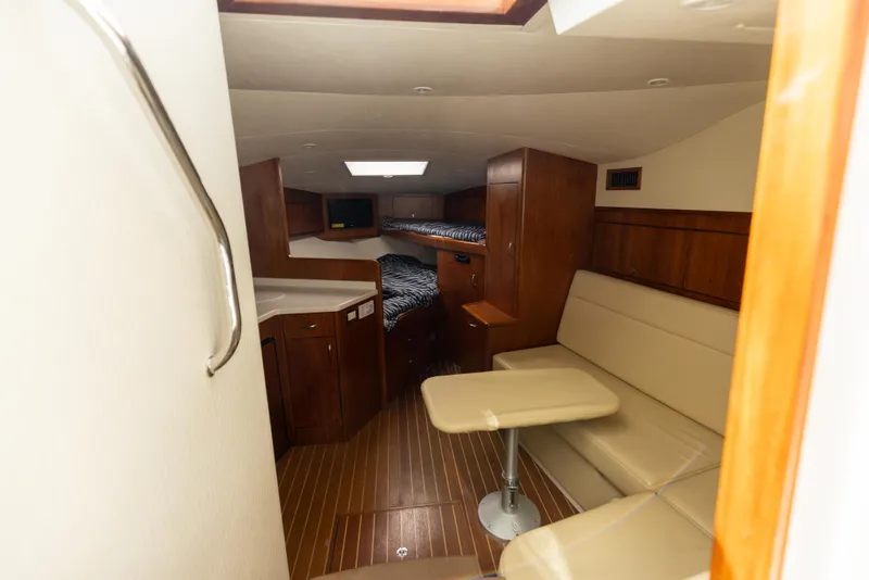 Slide: The Image of Interior cabin of 2013 Cabo 36 Express yacht with seating and sleeping area. - 18