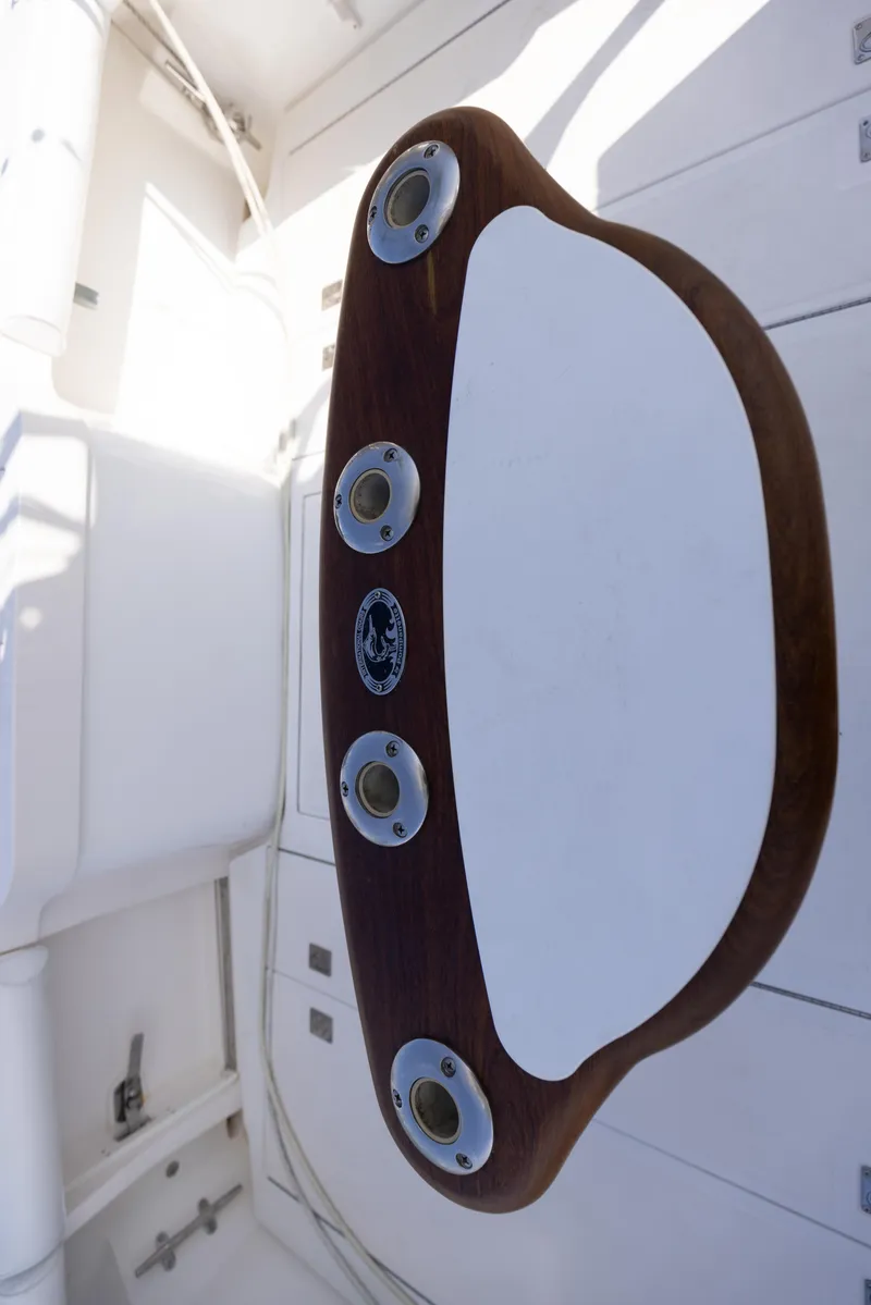 Slide: The Image of 2013 Cabo 36 Express boat interior with wooden and metal details. - 22