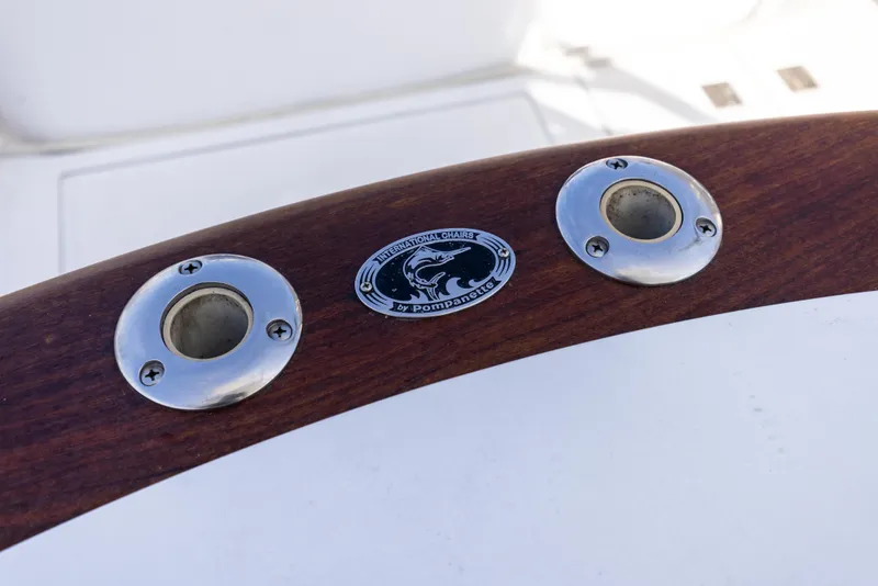 Slide: The Image of Close-up of 2013 Cabo 36 Express boat's wooden rail with metal fittings. - 23