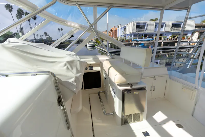Slide: The Image of 2013 Cabo 36 Express boat interior with helm station and seating. - 28