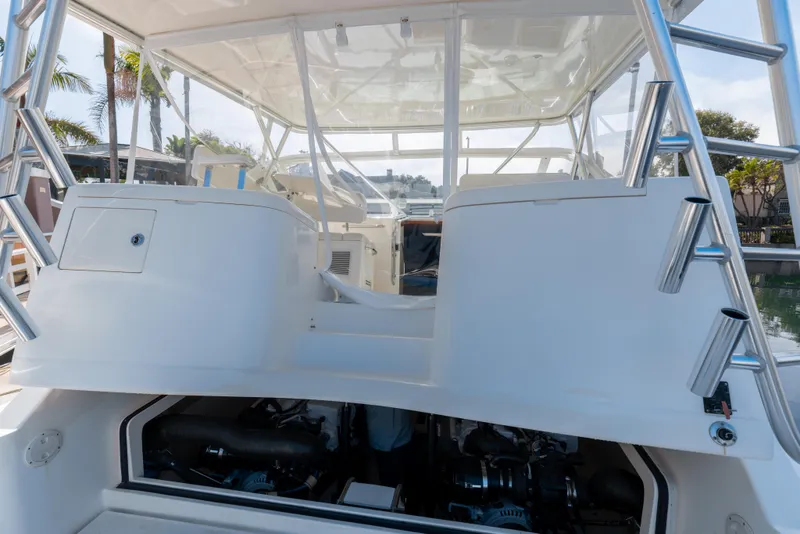 Slide: The Image of 2013 Cabo 36 Express boat with open engine compartment. - 9