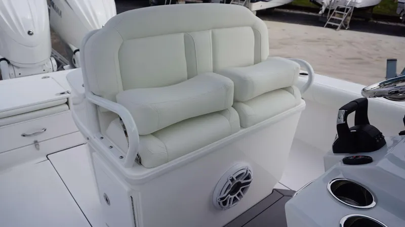 Slide: The Image of 2024 Everglades 273 CC boat with dual Yamaha engines and cushioned seating. - 18