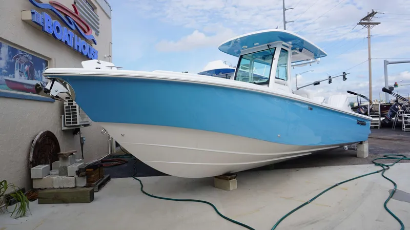 Slide: The Image of 2024 Everglades 273 CC boat displayed at The Boathouse dealership. - 22