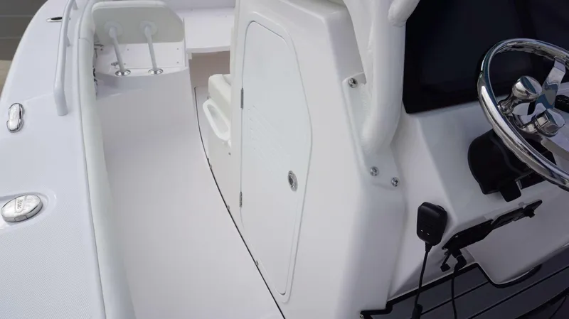 Slide: The Image of 2024 Everglades 273 CC boat console and steering wheel close-up. - 4