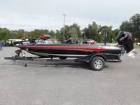 The Image of 2024 Ranger Z519 boat on a trailer in an outdoor setting. - 0
