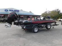 Slide: The Image of 2024 Ranger Z519 boat on trailer outside dealership. - 13