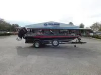 Slide: The Image of 2024 Ranger Z519 boat on trailer in front of dealership. - 14