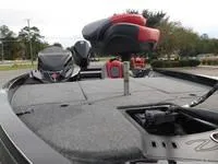 Slide: The Image of 2024 Ranger Z519 fishing boat with red and black seats and spacious deck. - 6