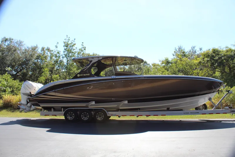 Slide: The Image of 2016 Mystic Powerboats M4200 on a trailer, side view. - 13